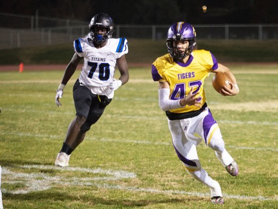 Lemoore's Ty Chambers takes off on a long run against Frontier High School Friday night in Tiger Stadium.